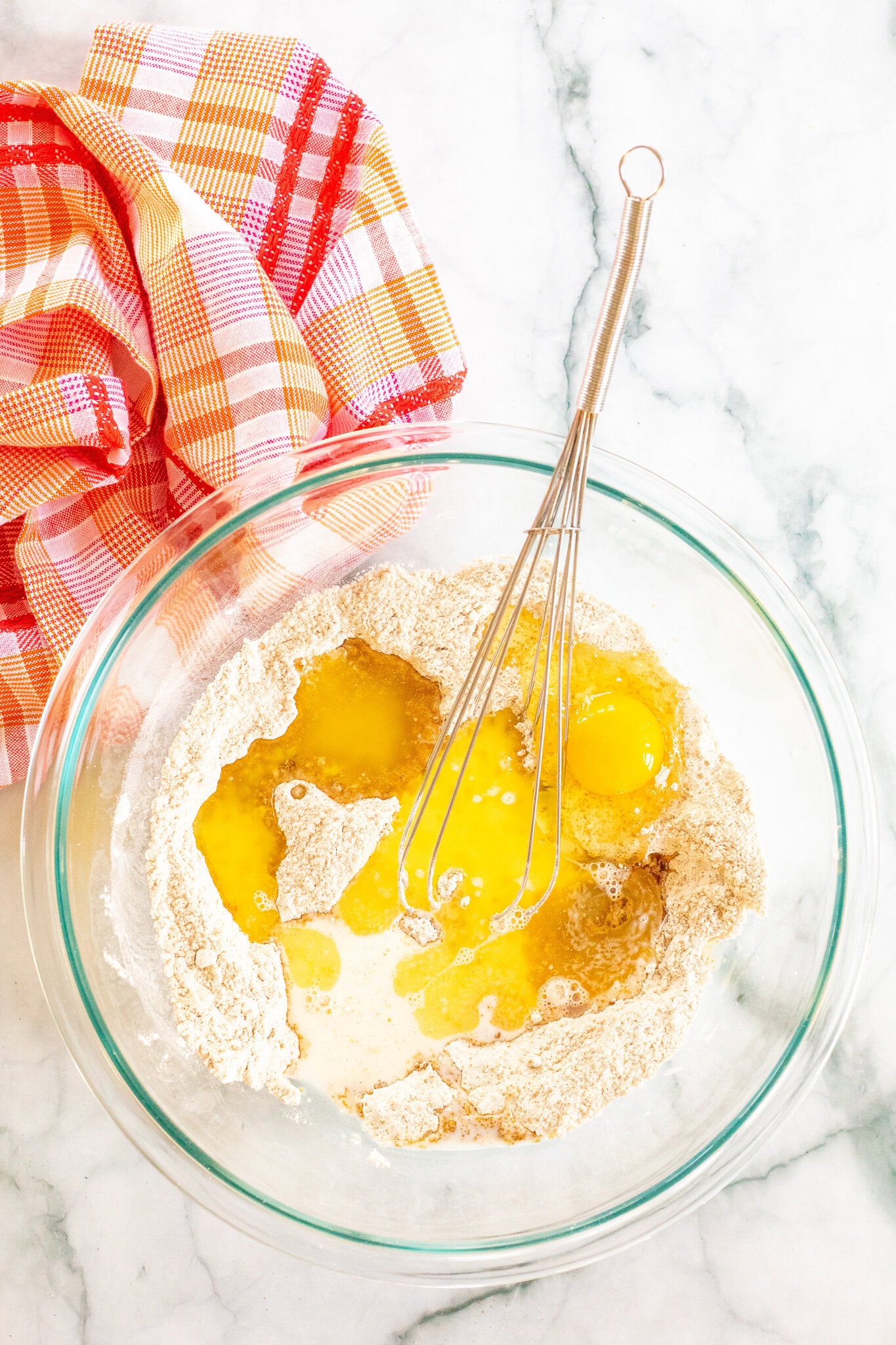 In a mixing bowl, eggs, milk, and butter is going to be whisked