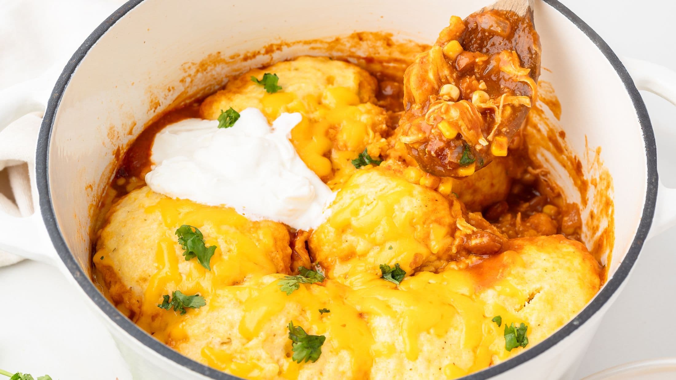 A scoop showing a spoonful of chicken chili