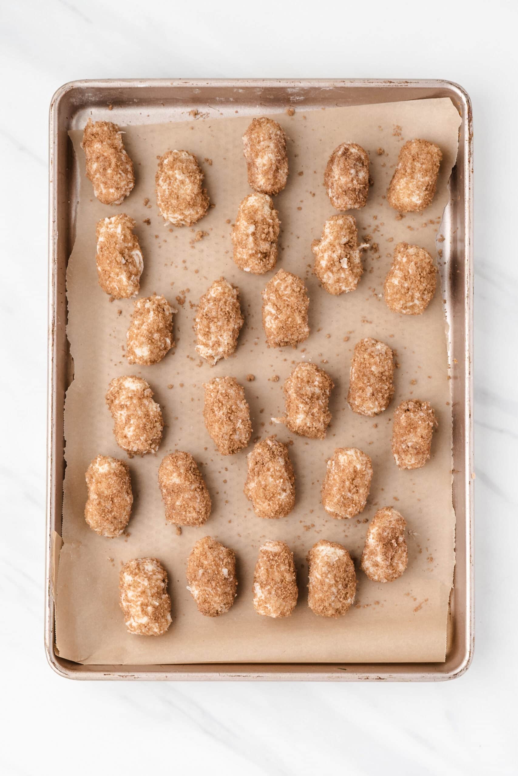 Irish potato candy on a baking sheet, ready to be plated and enjoyed