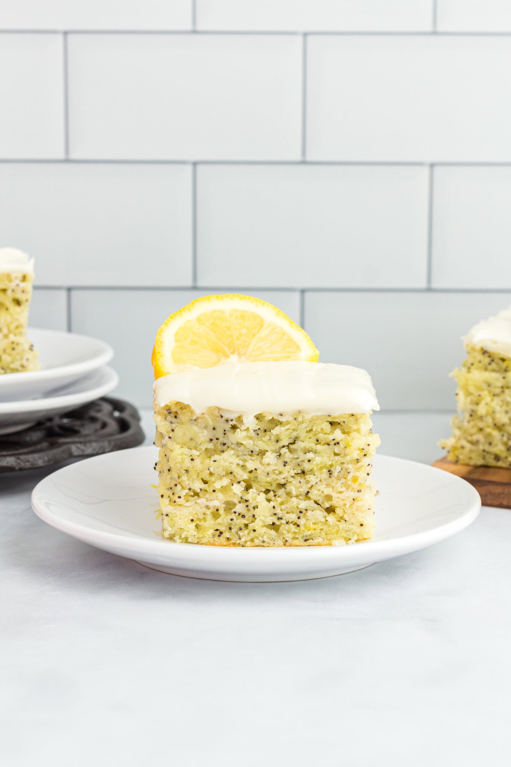close up of a square piece of the lemon poppy seed on a plate