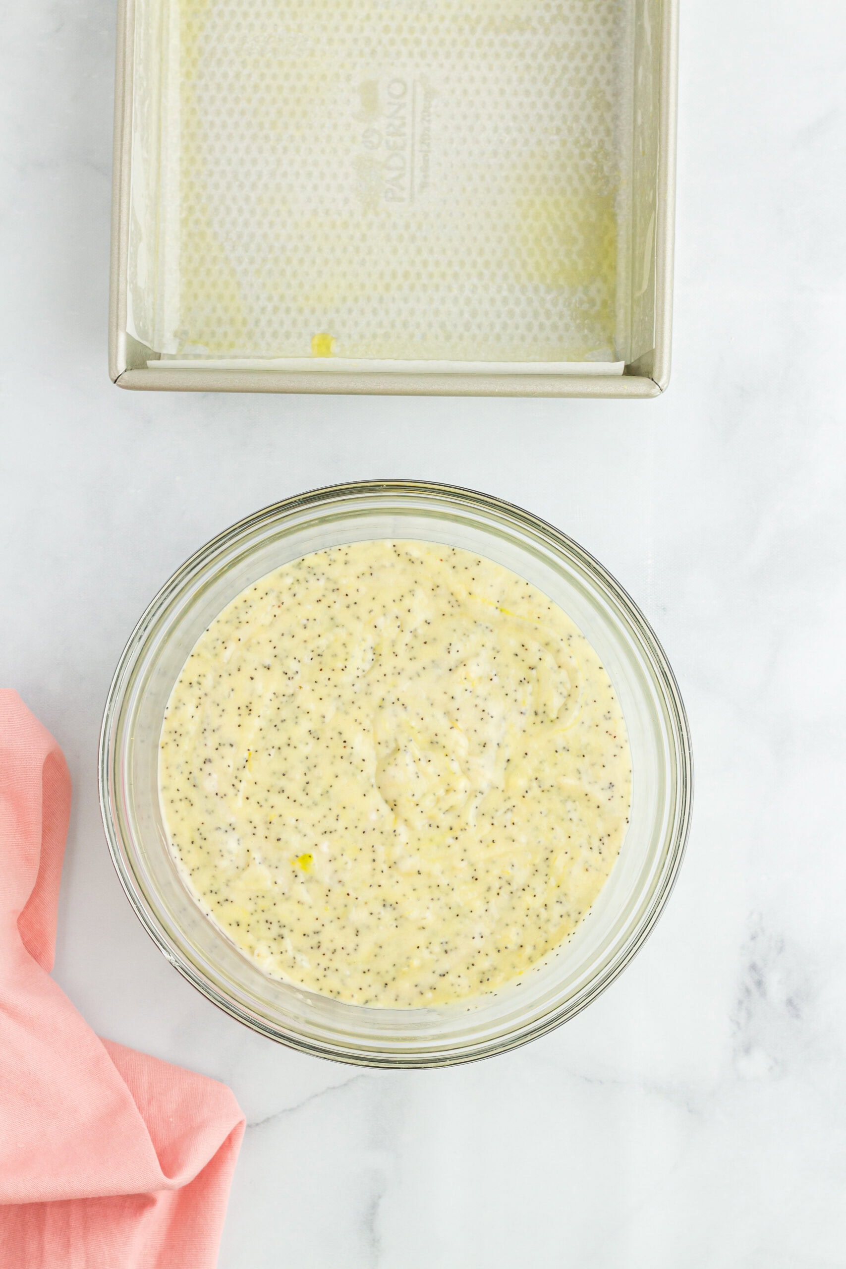 Lemon poppy seed batter, ready to be poured into a greased baking pan to bake