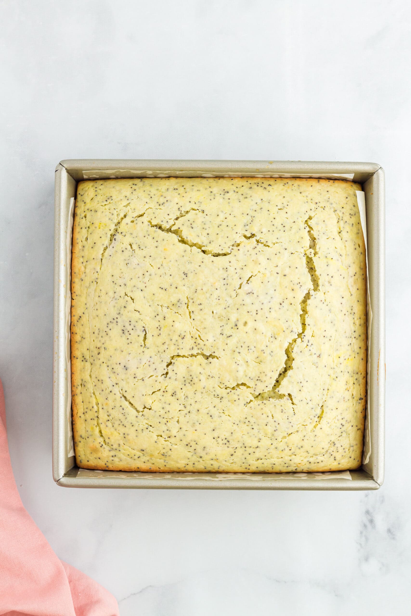 Lemon poppy seed cake all baked ready to be frosted