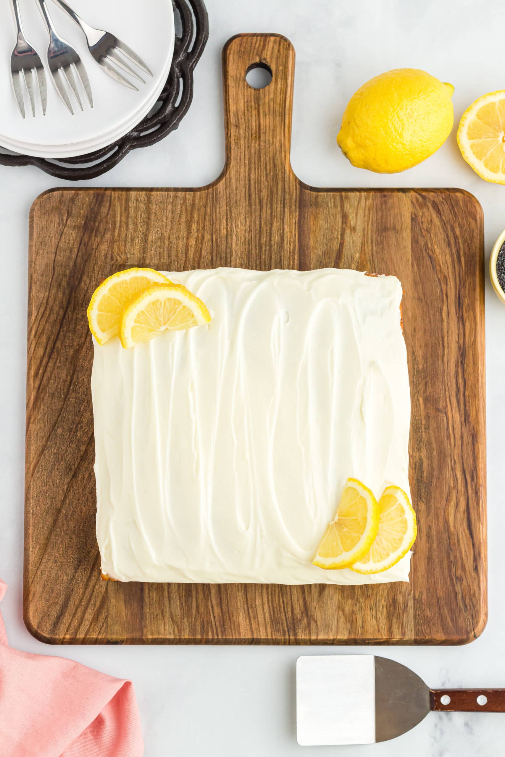 Lemon poppy seed cake on a wooden board