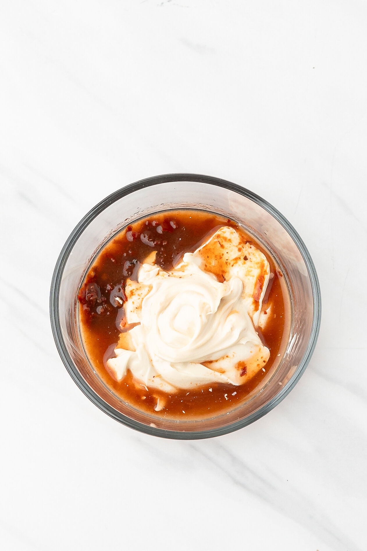 Making the chili mayo in a bowl
