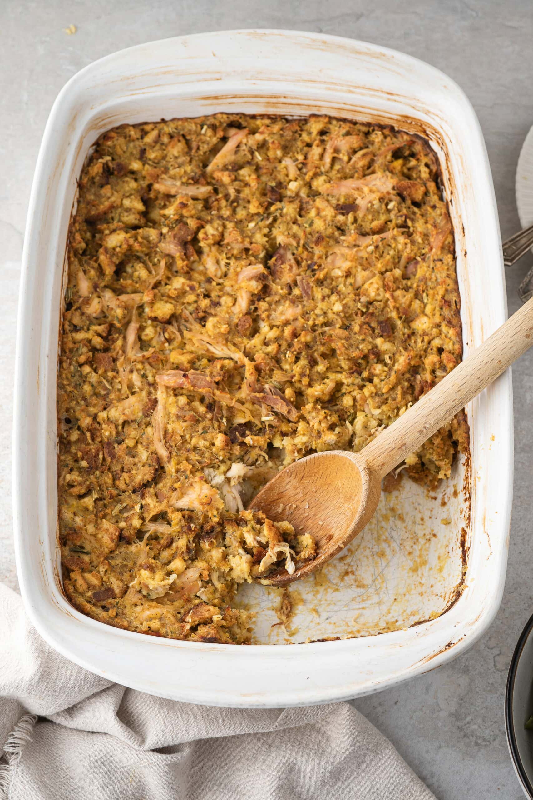 Stove top stuffing and rotisserie chicken casserole all baked and a scoop has been taking out