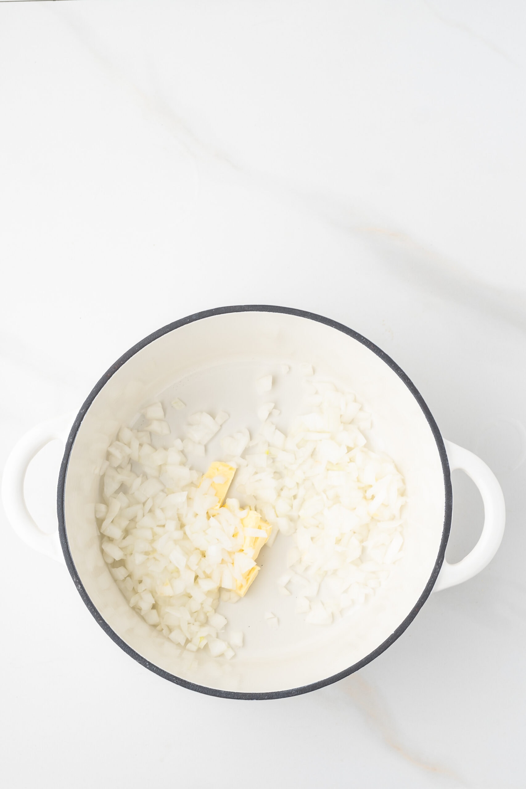Butter and diced onions in a dutch oven