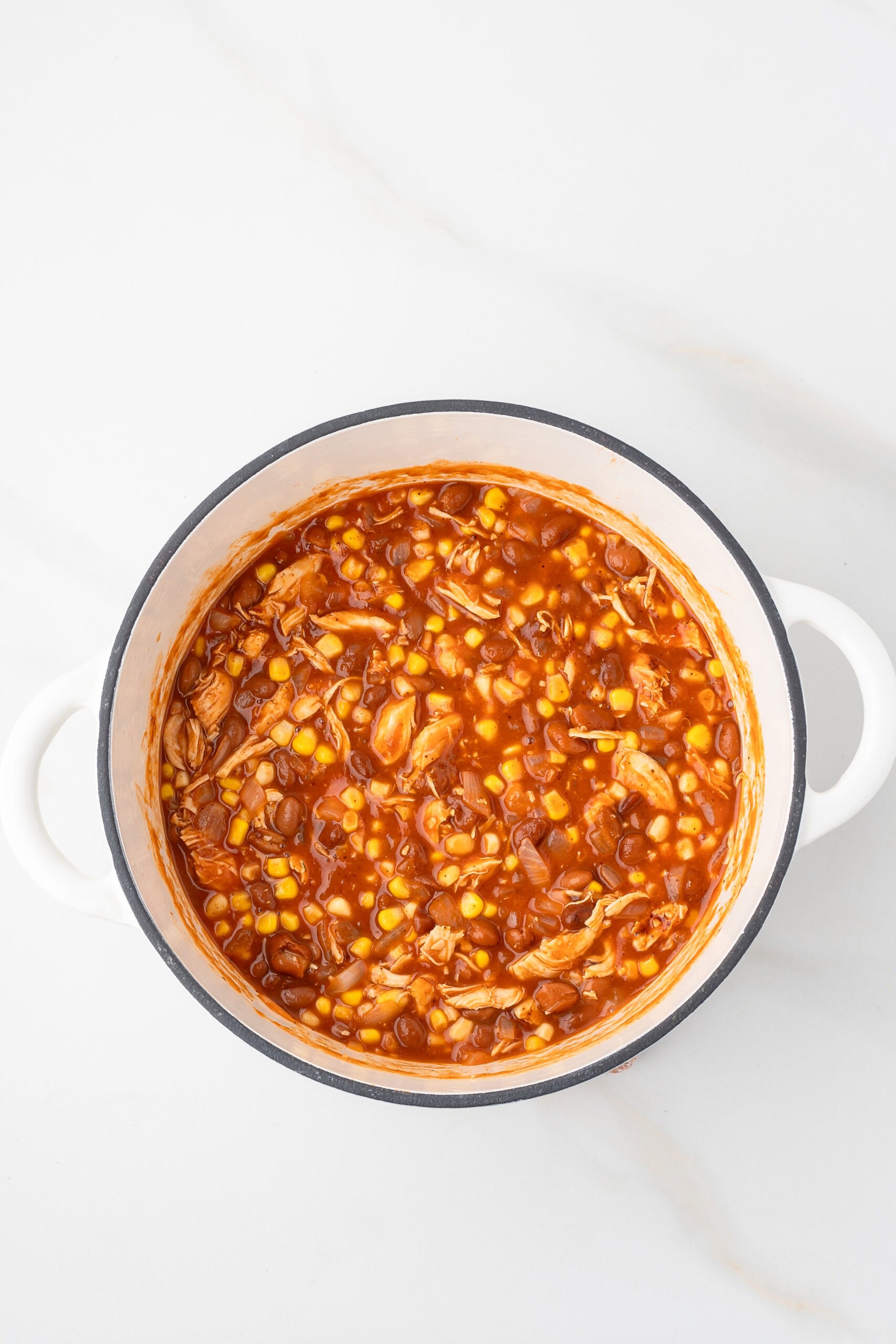 Chicken chili with all ingredients in dutch oven