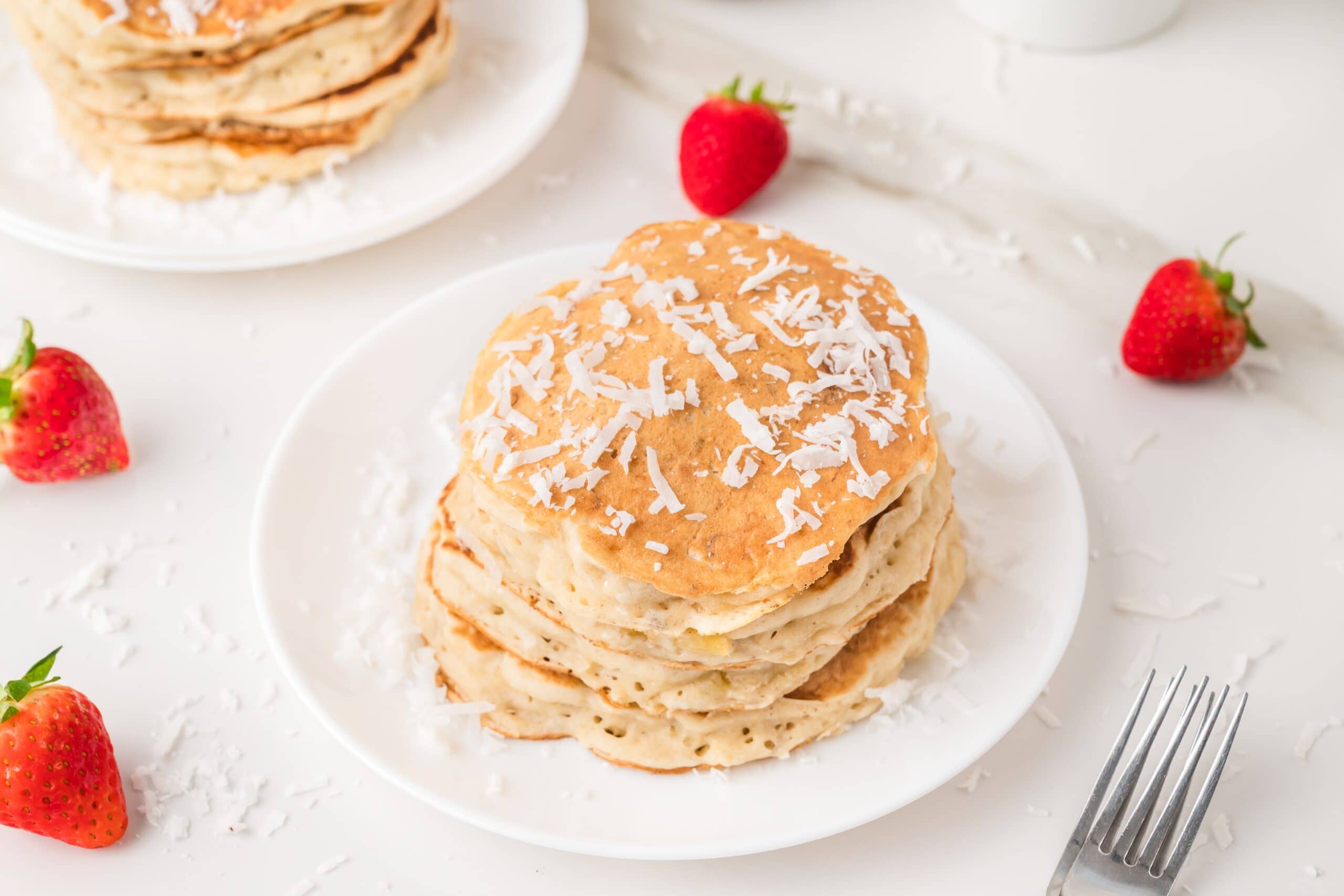 Coconut pancakes on white plate