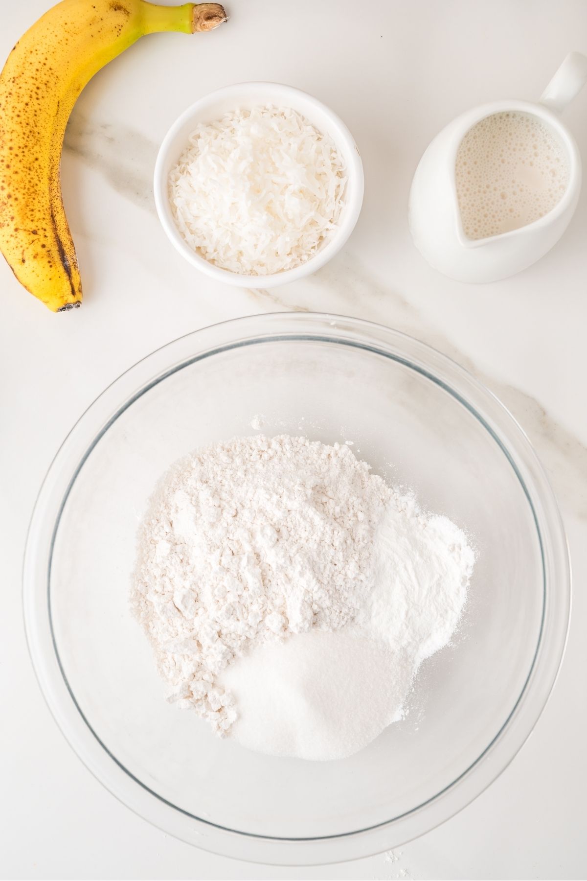 Coconut pancake batter stirred in a mixing bowl