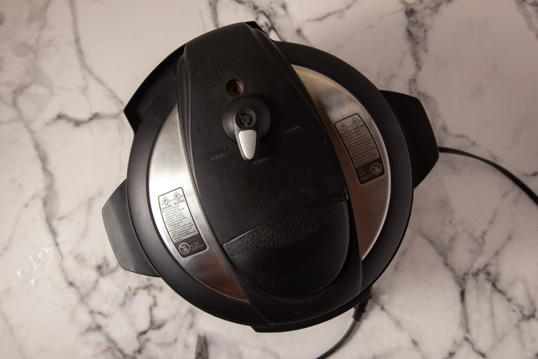 Instant Pot lid closed for strawberry cheesecake