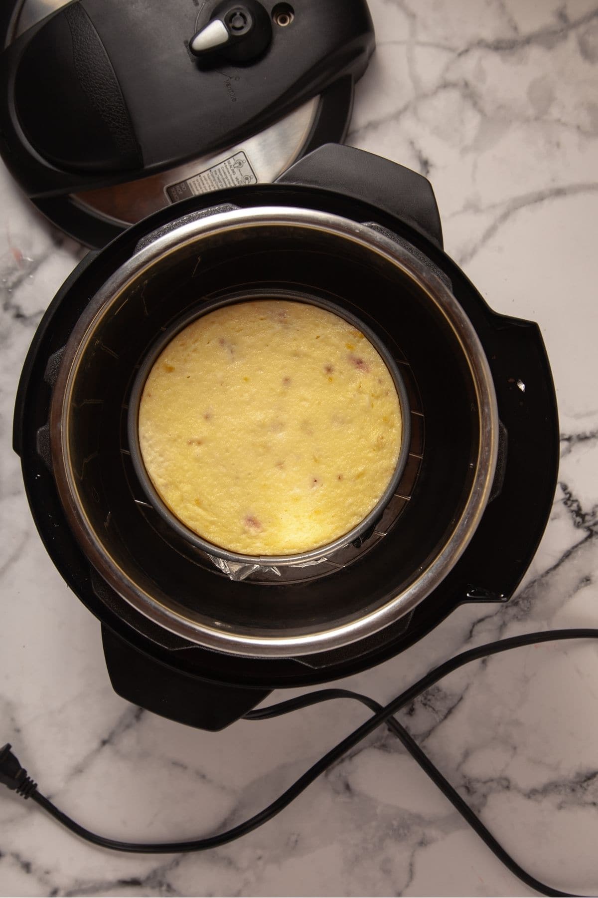 Strawberry cheesecake cooked in springform pan inside Instant Pot