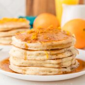 fluffy orange pancakes with syrup