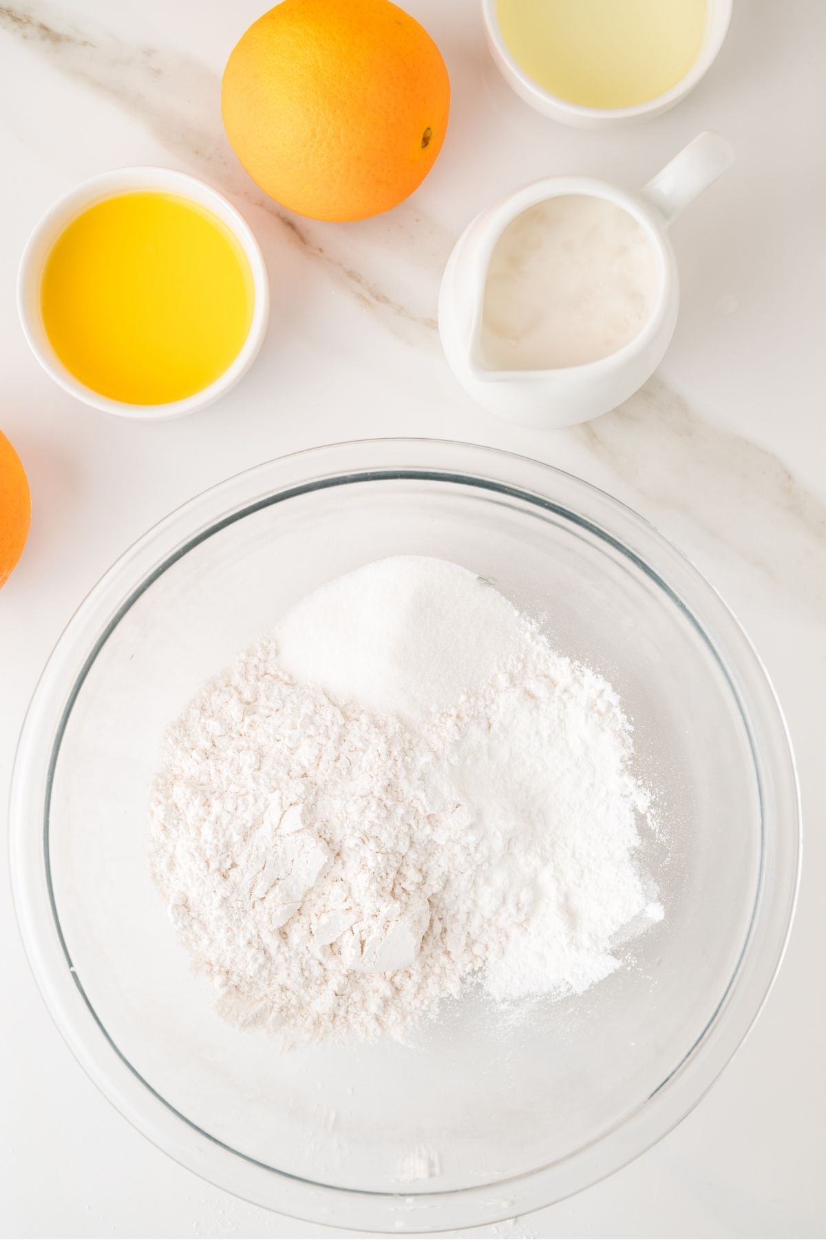 Orange pancake batter being whisked in bowl