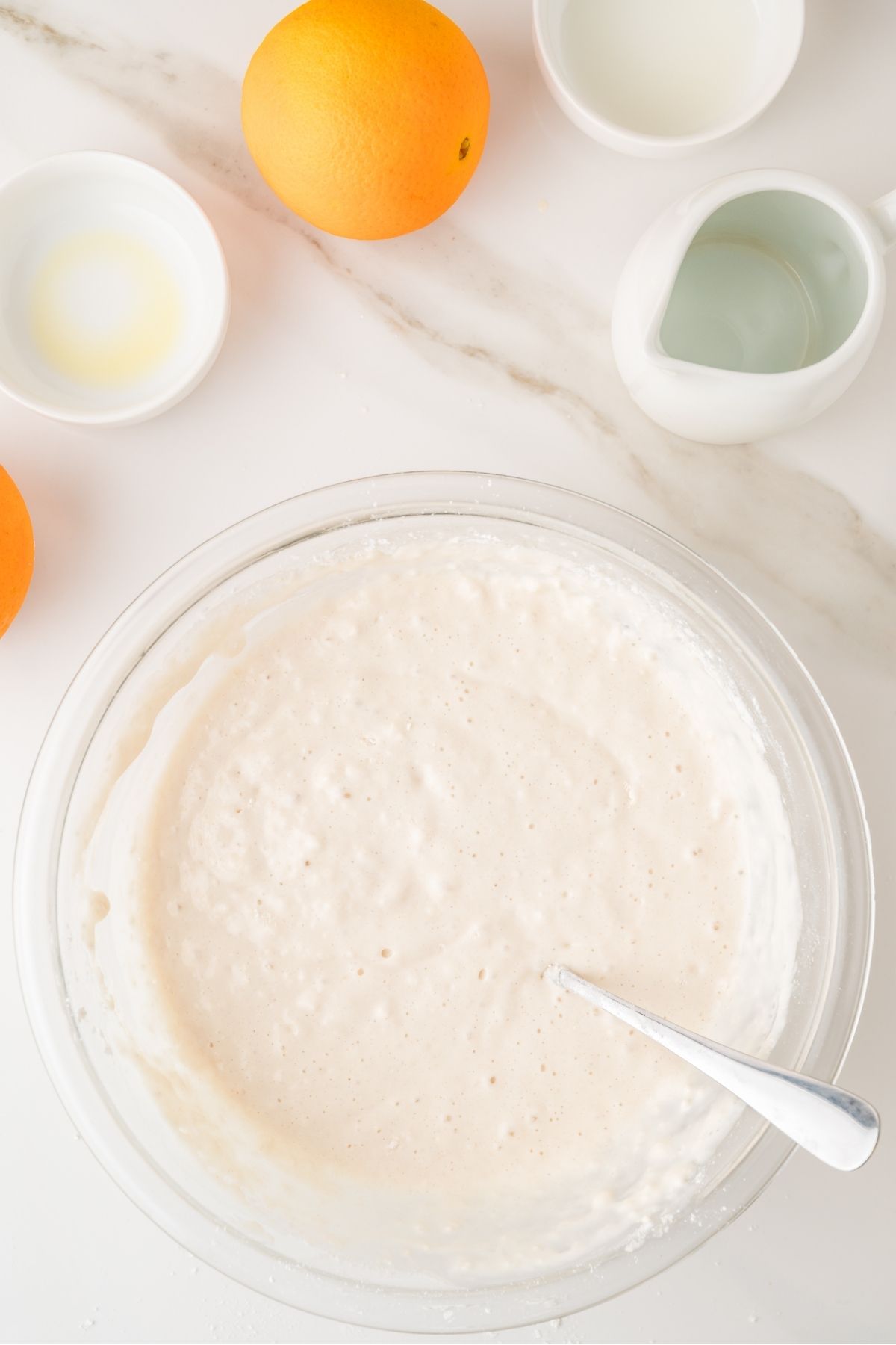 Orange pancake batter mixed in a bowl