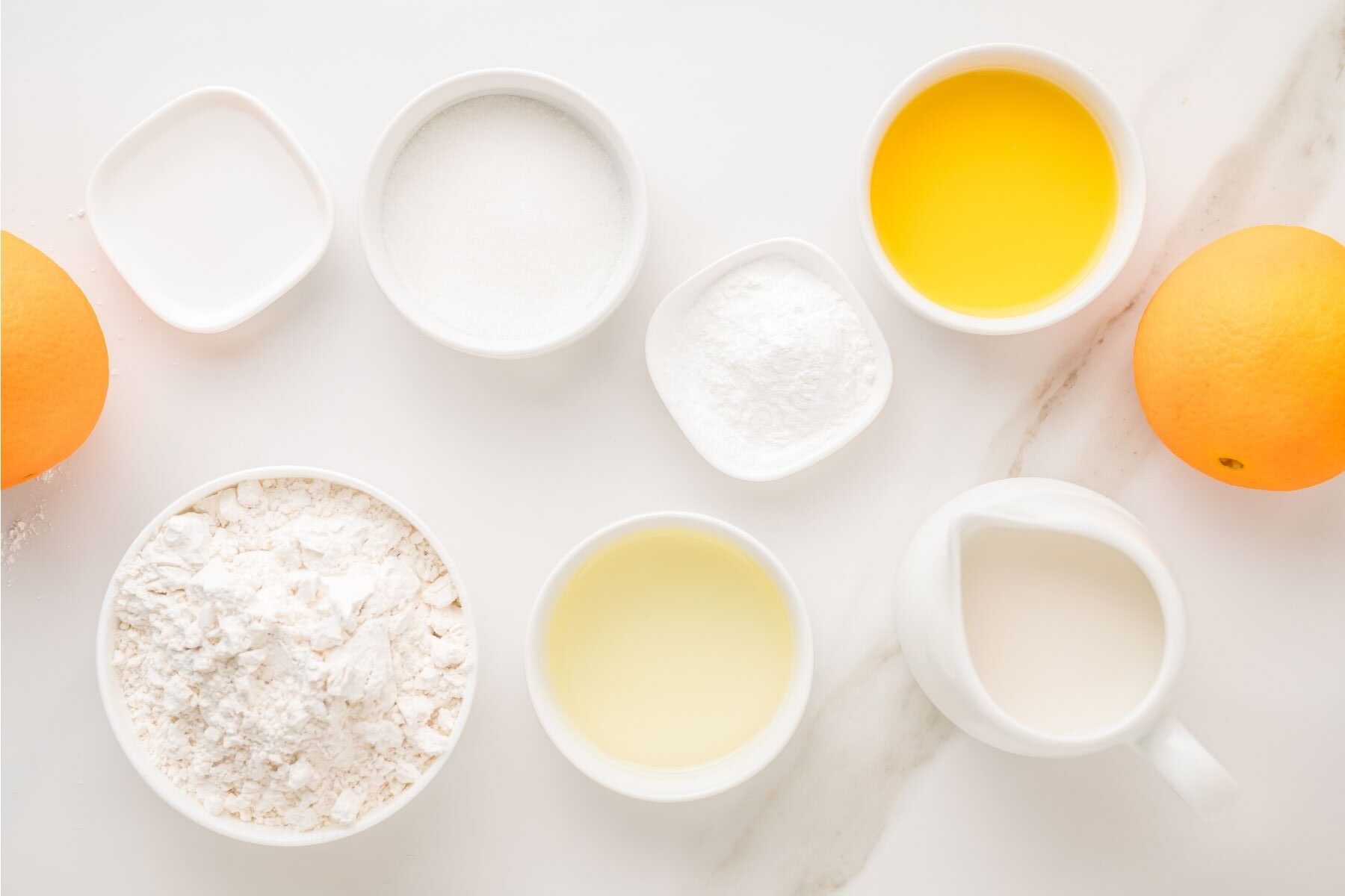 Orange pancake ingredients with flour and oranges