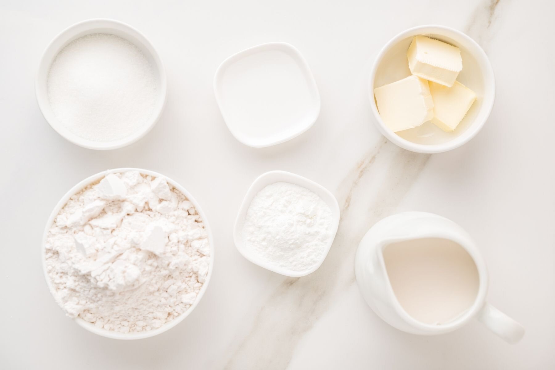 Scrambled pancake ingredients with flour, eggs, and milk
