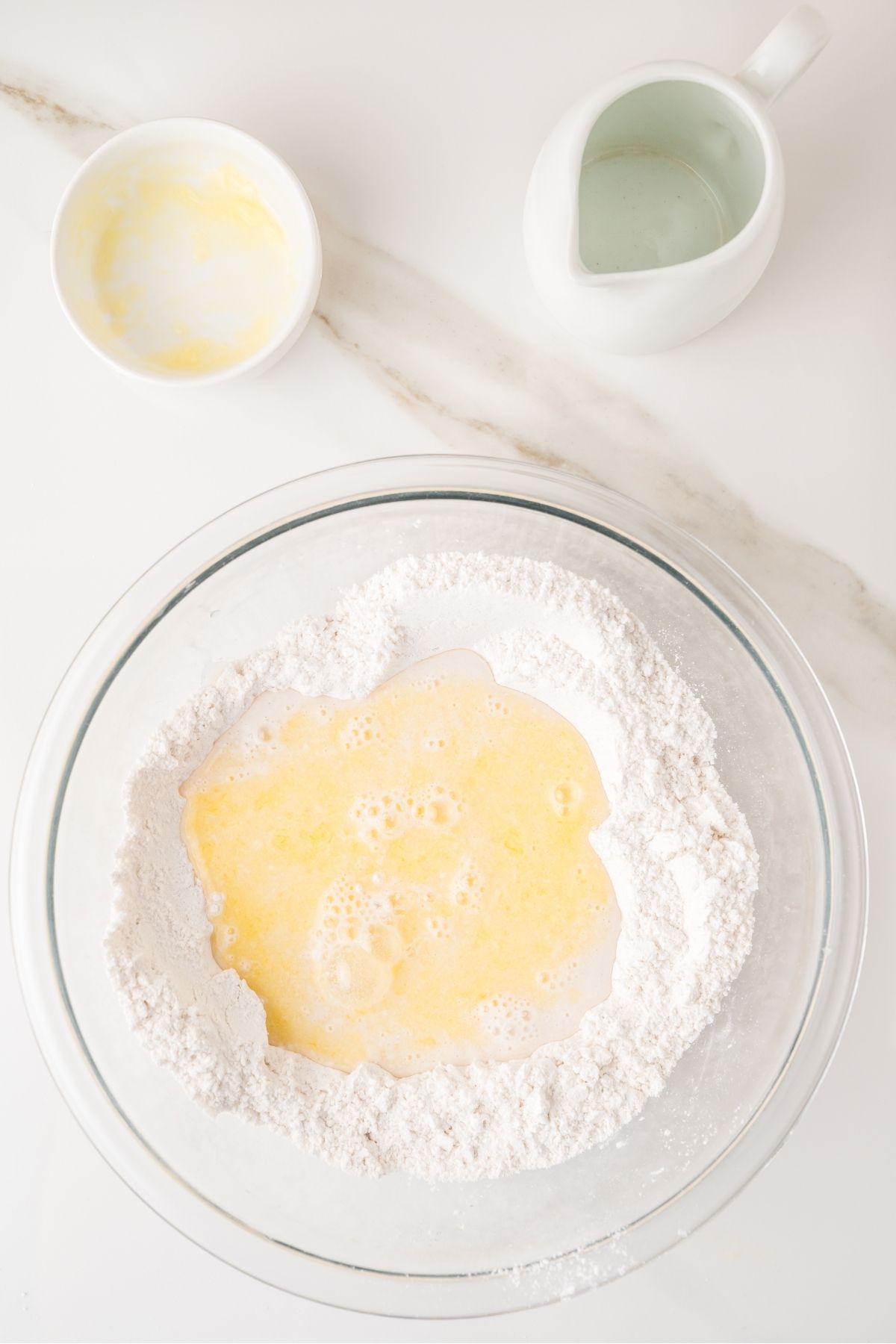 Scrambled pancake ingredients with flour, eggs, and milk