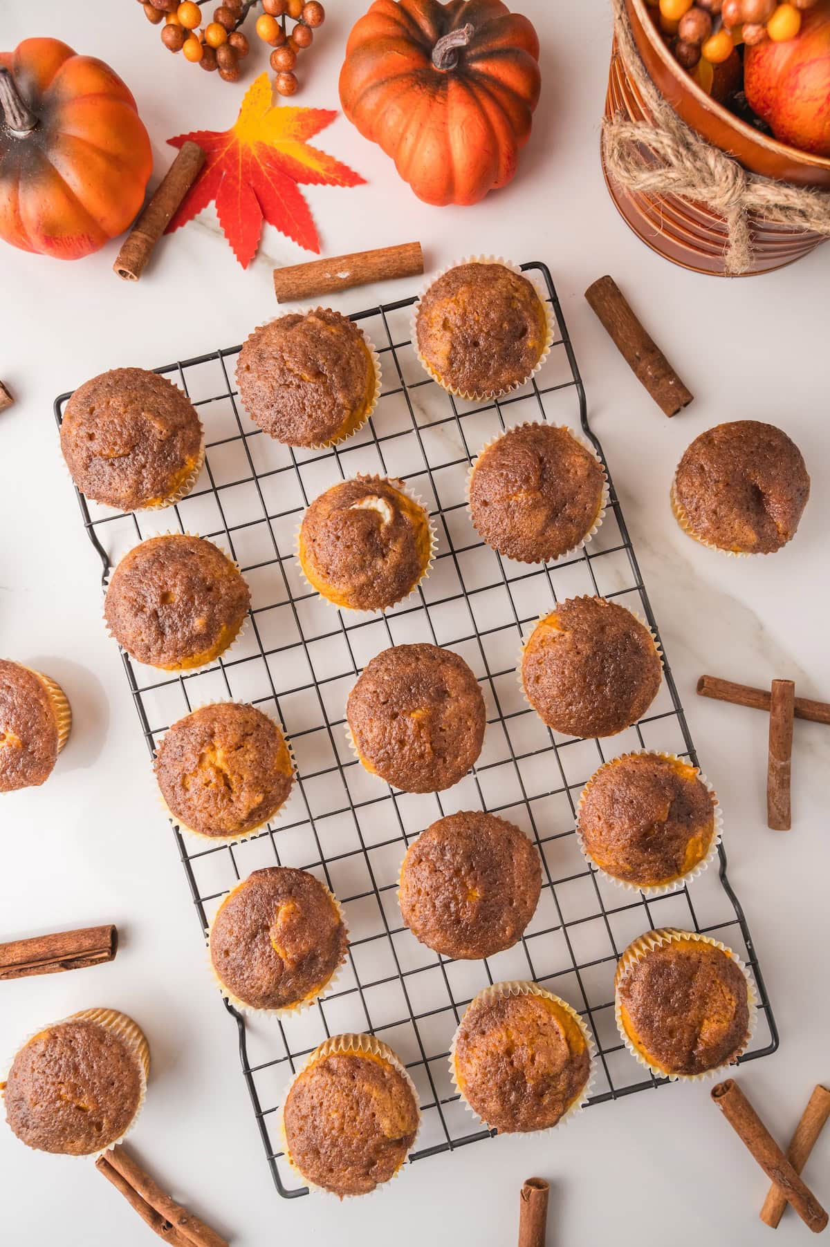 pumpkin cream cheese muffins cooling on a wire rack