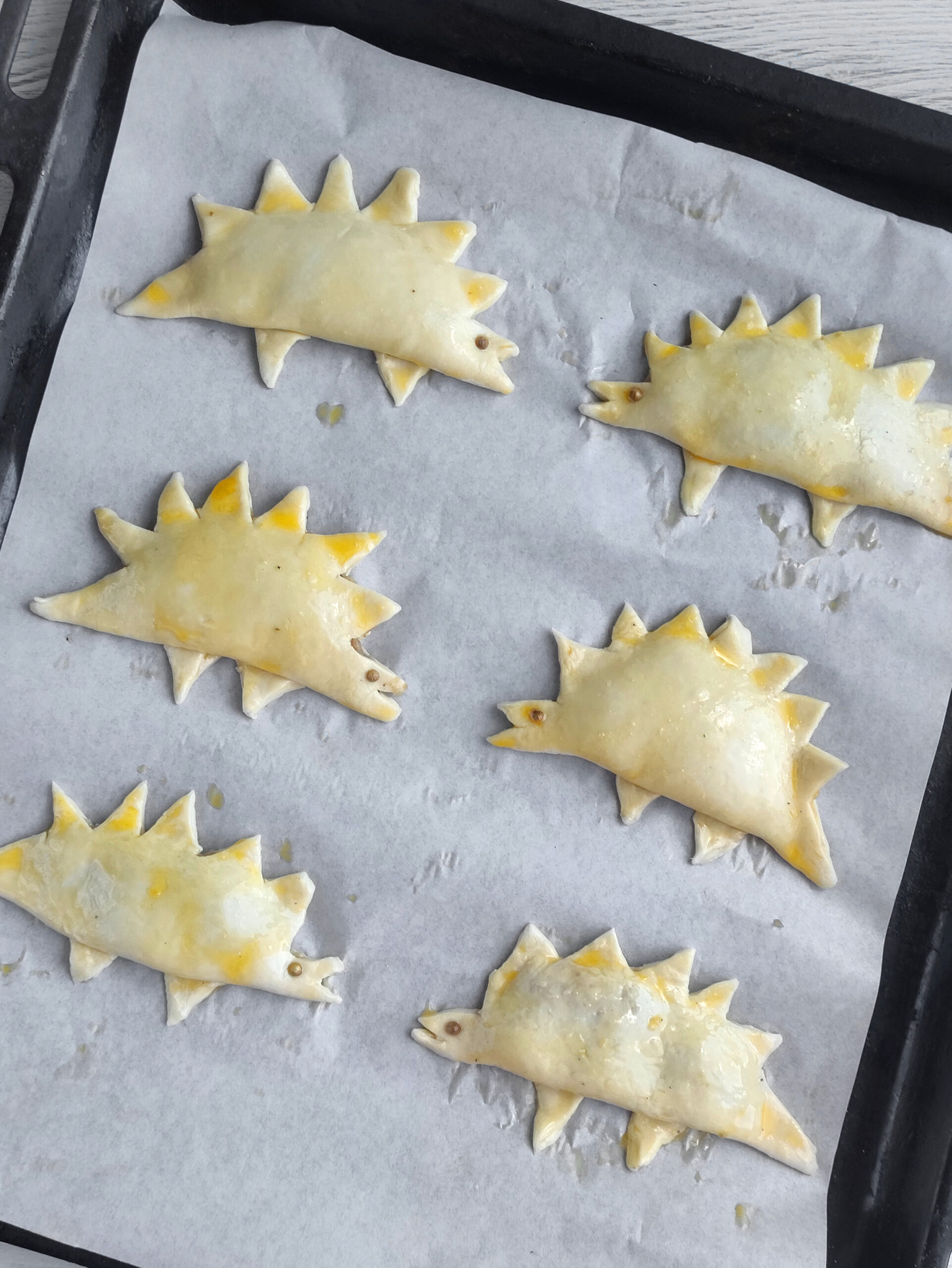 Unbaked dinosaur chicken empanadas