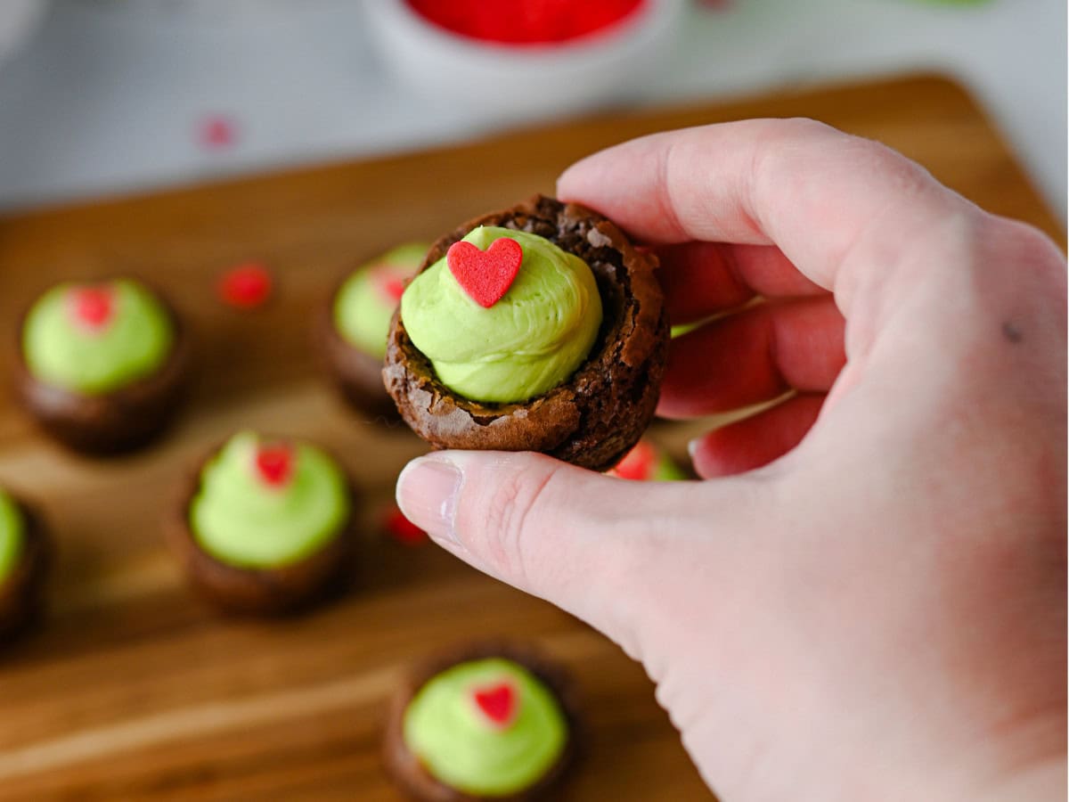 Mini Grinch brownies with green frosting