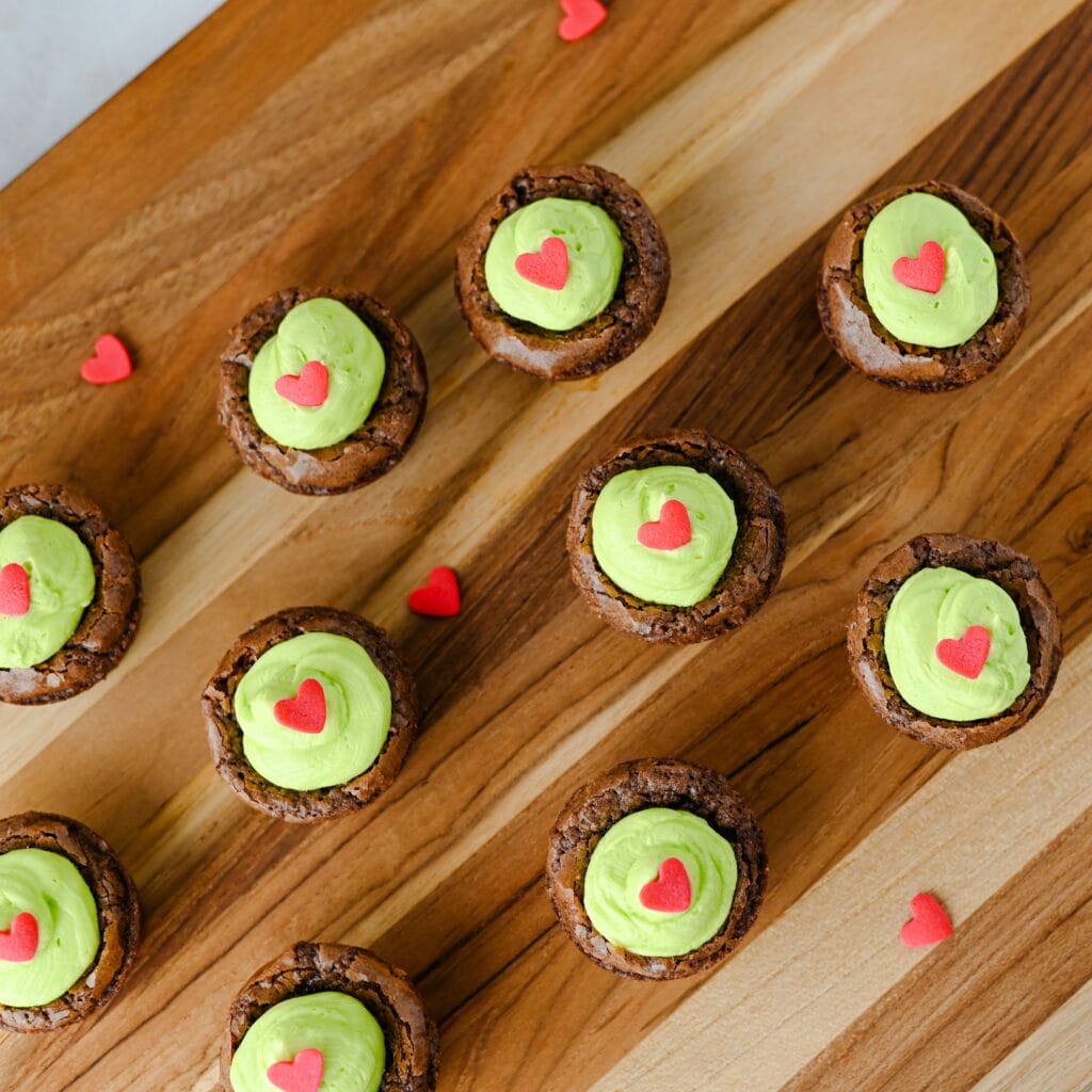 Grinch brownie bites with heart sprinkles