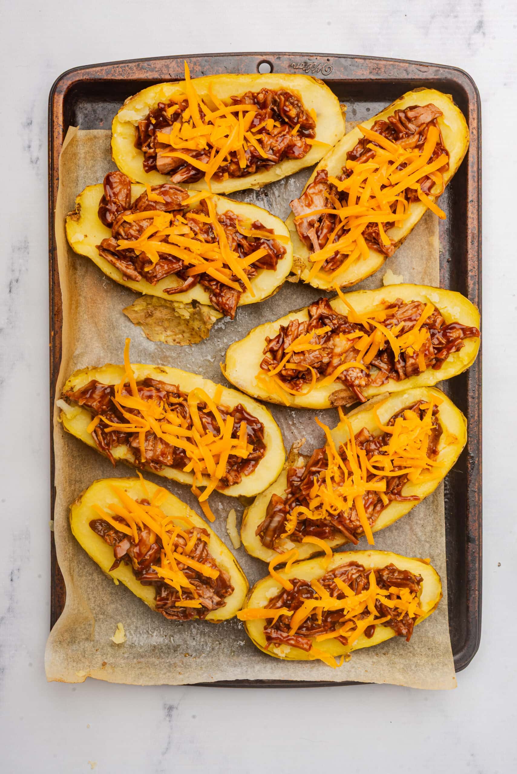 Cheesy pulled beef potato skins