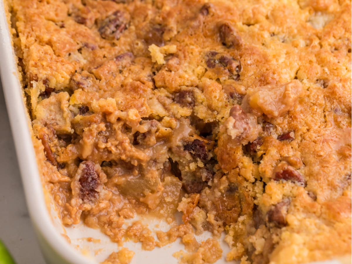 Apple dump cake served with melting ice cream