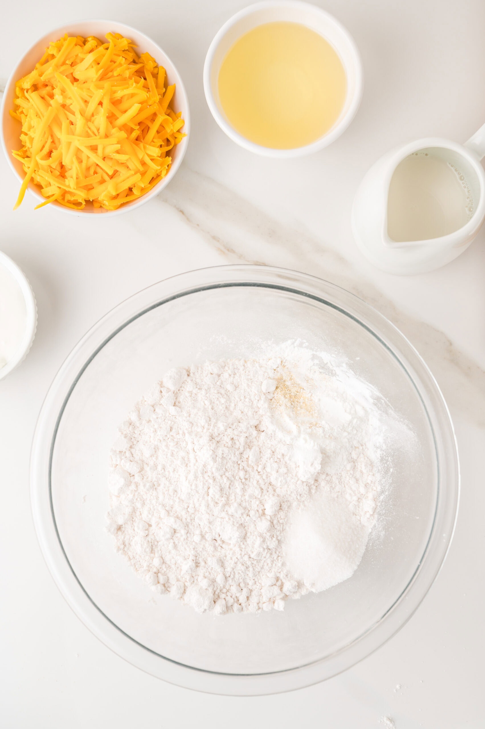 Simple ingredients for homemade cheddar cheese muffins