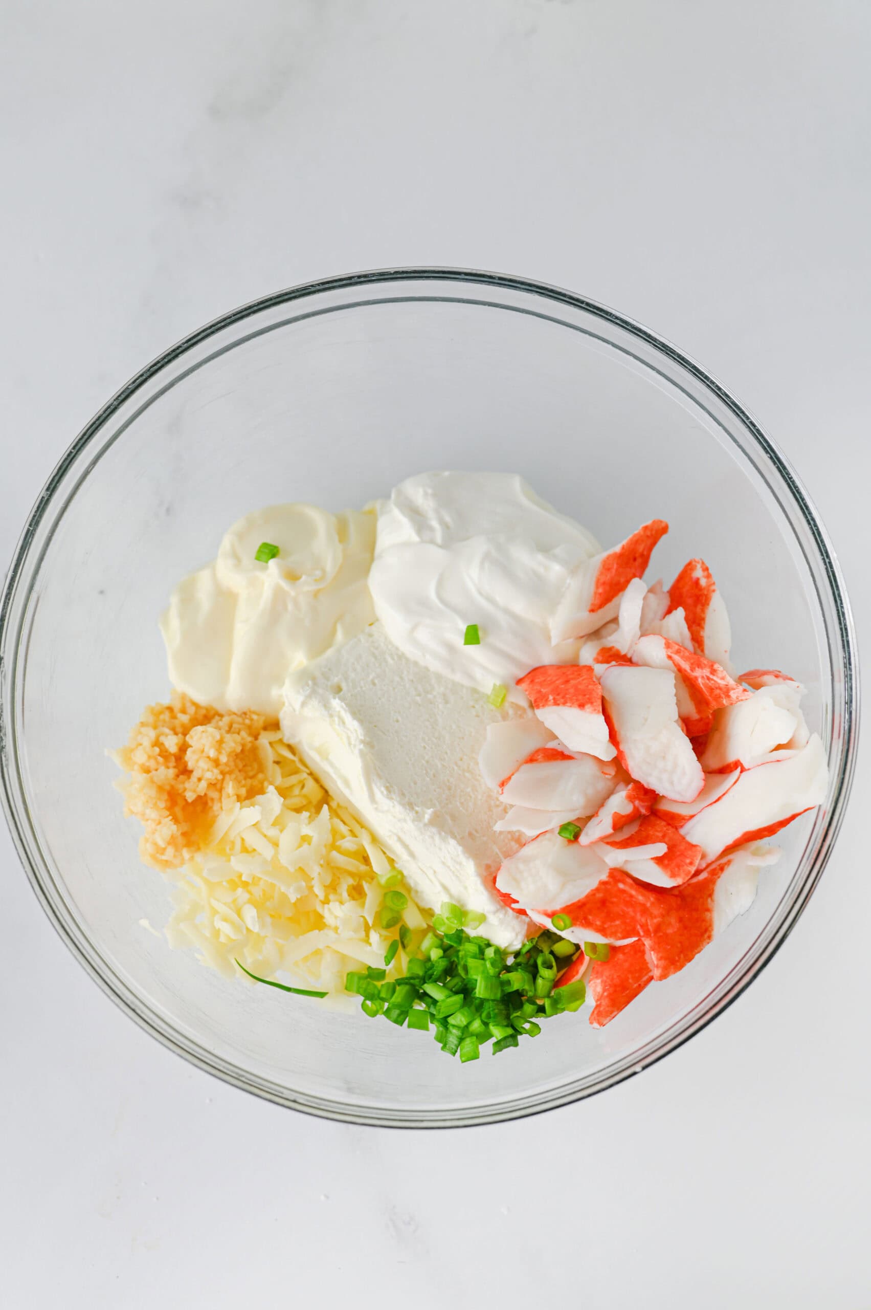 Crab rangoon dip ingredients in mixing bowl