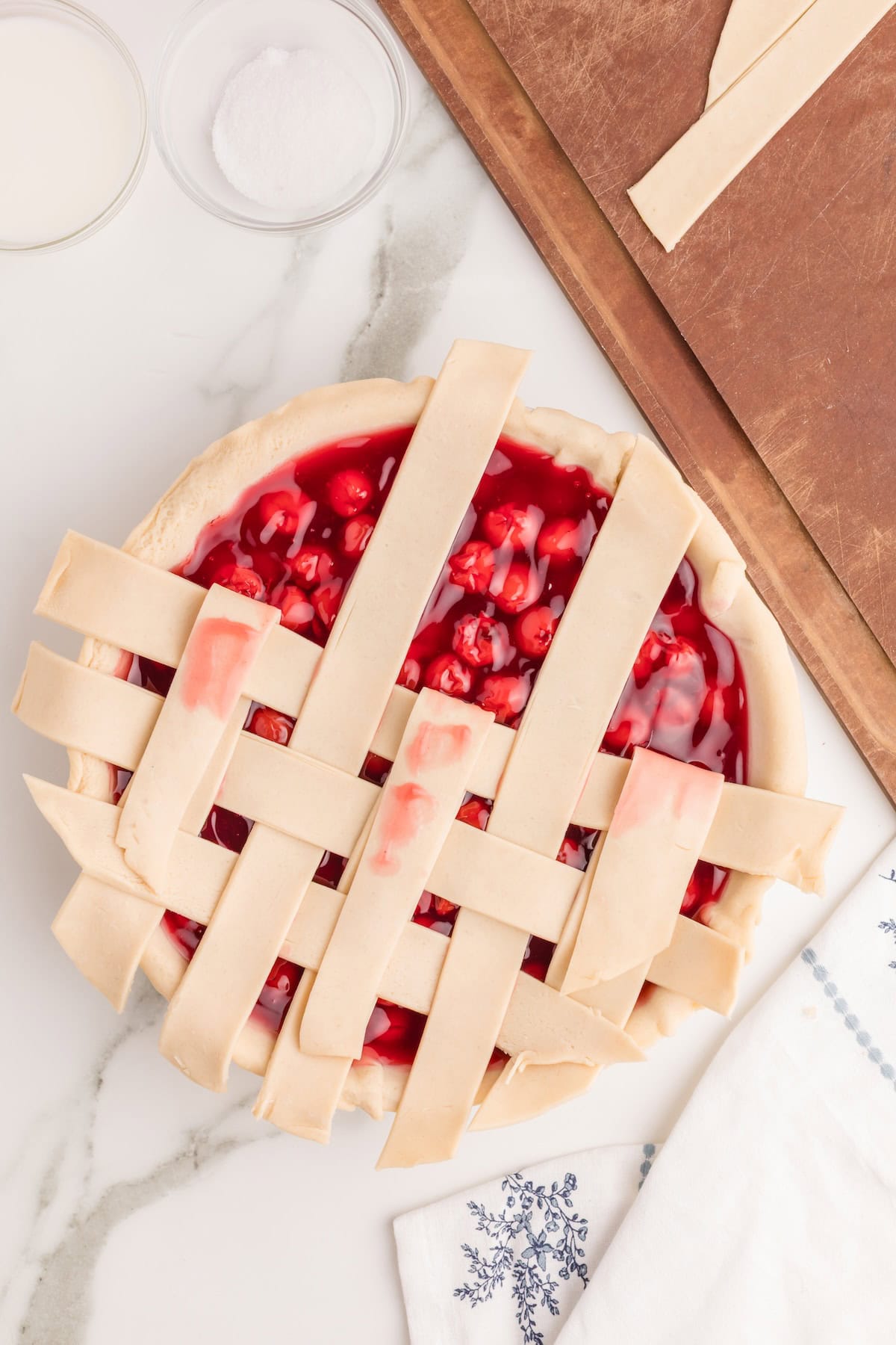 repeat the process on the top half of the pie, folding the strips down instead of up