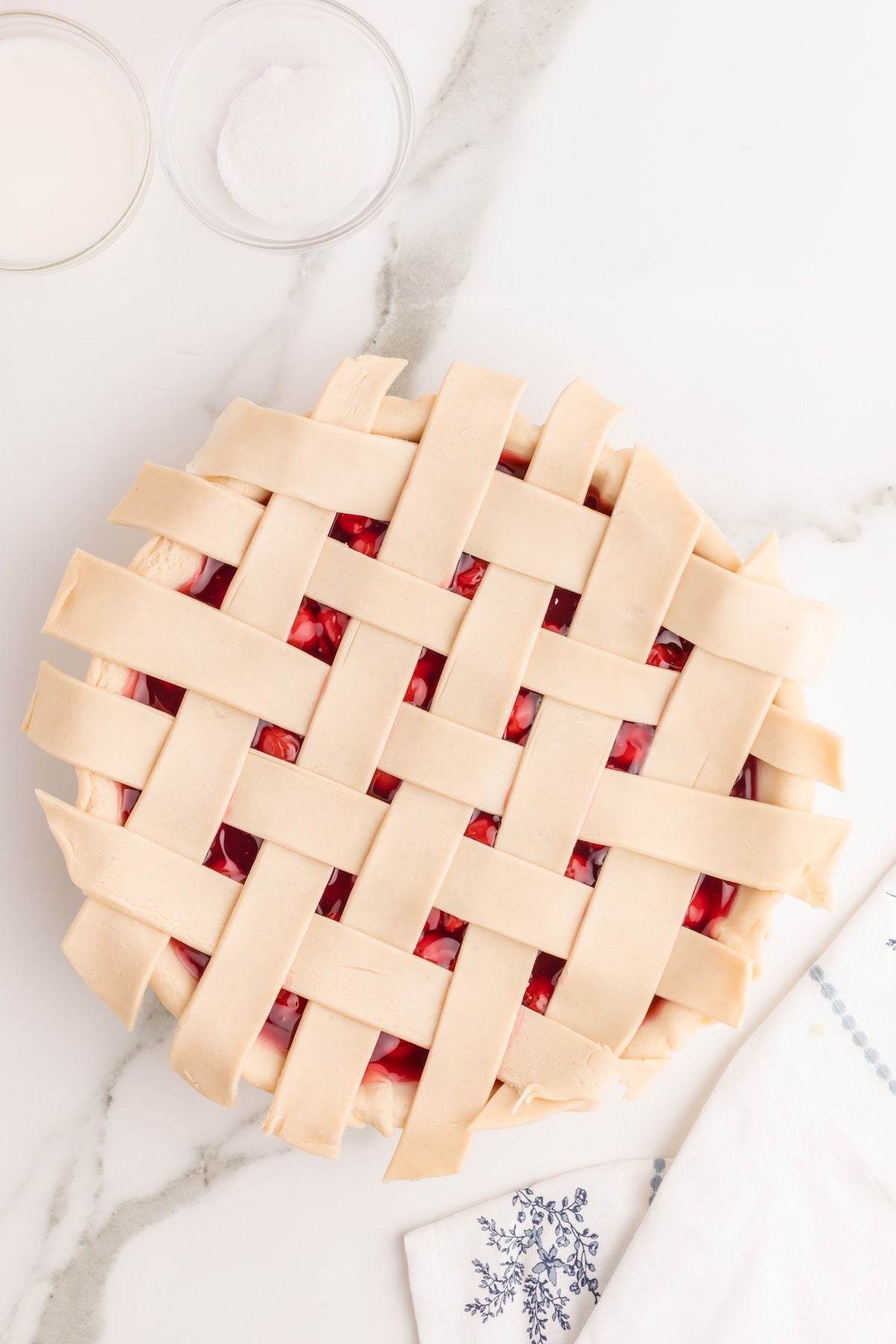 place the last piece of the crust across the pie and fold the strips back into place