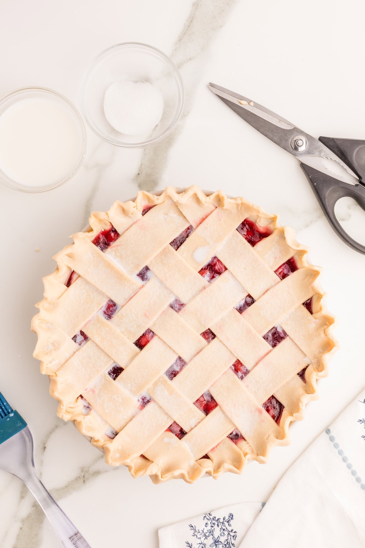 dust the cherry pie with sugar all over the top