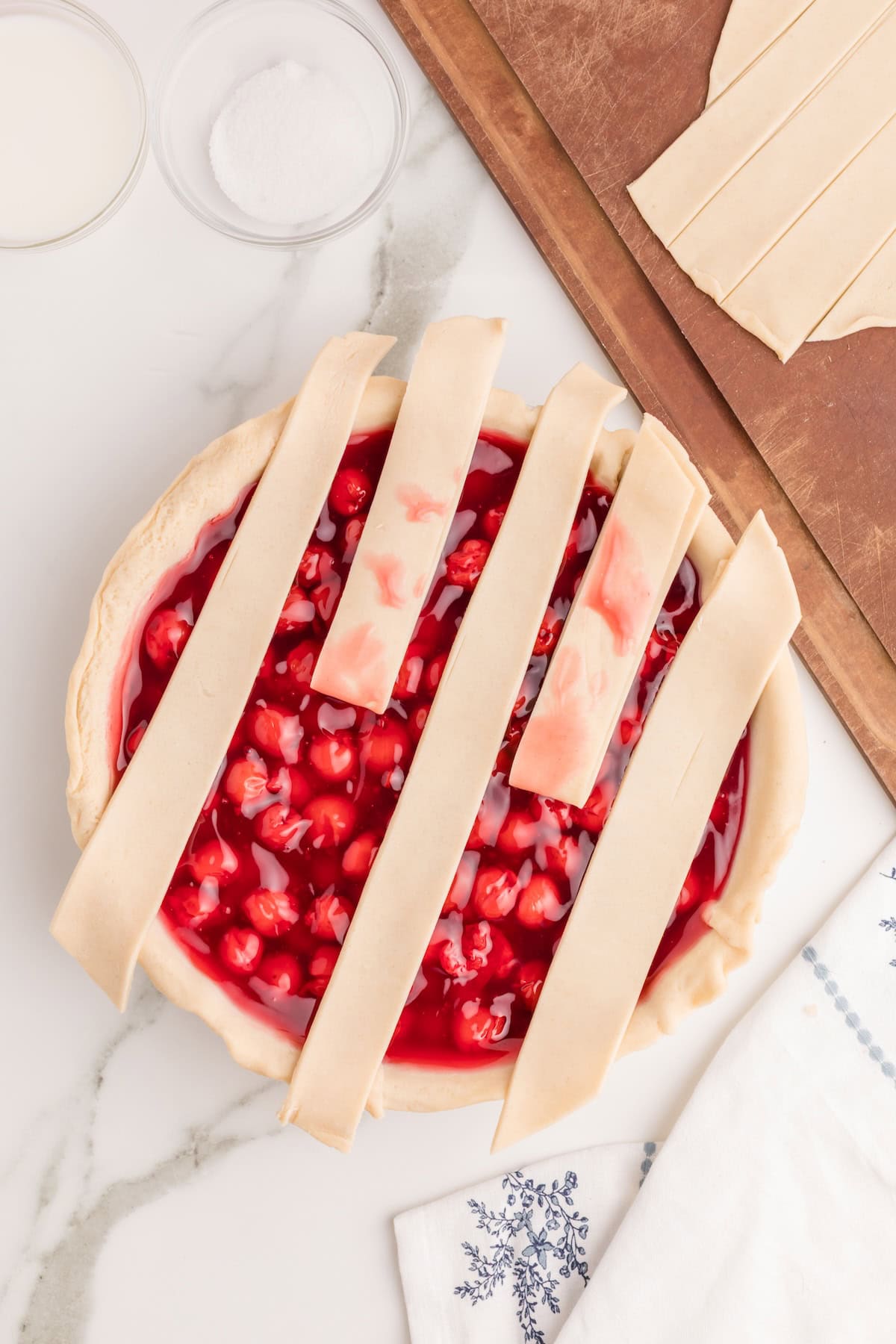 lift every other strip halfway up the pie and fold it over