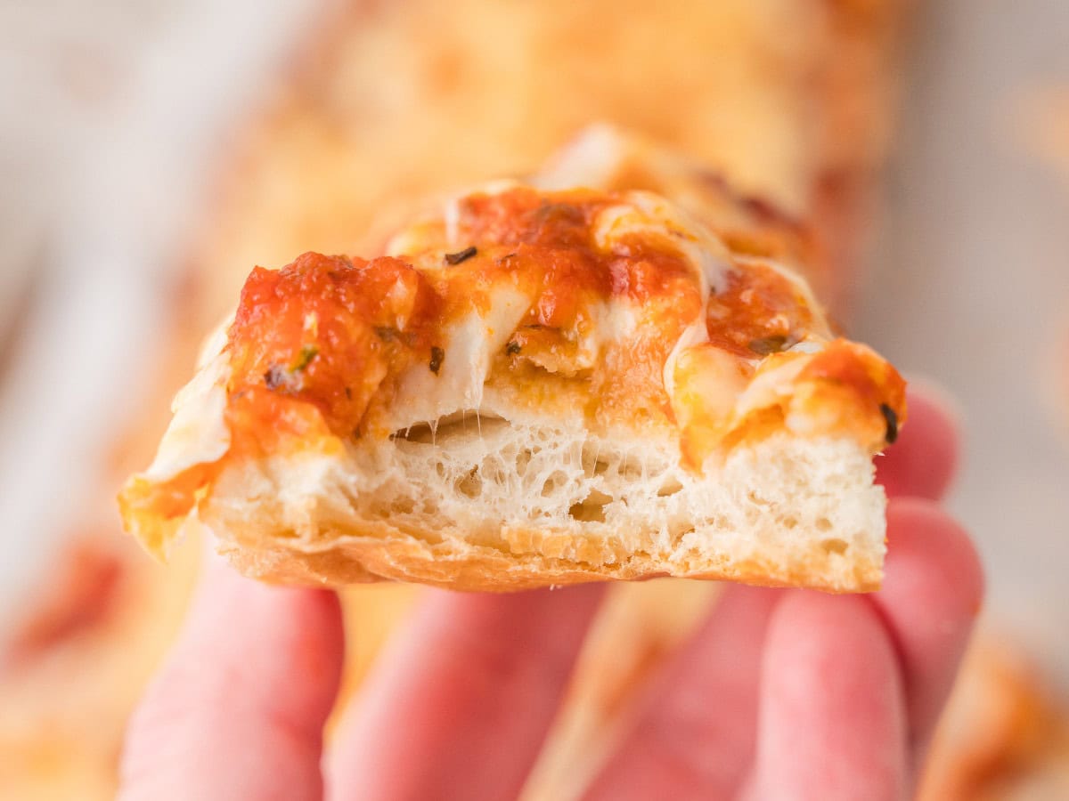 Homemade French bread pizza with melted mozzarella