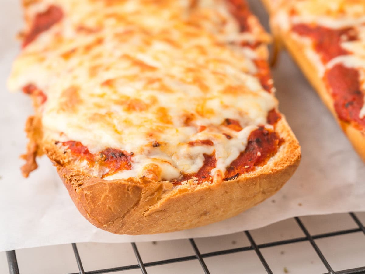 Crispy garlic bread pizza with gooey cheese