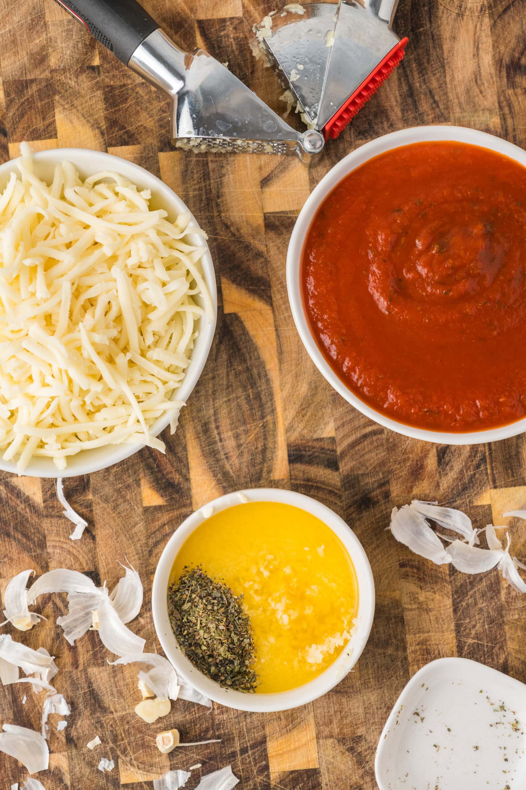 Homemade French bread pizza ingredients with garlic butter