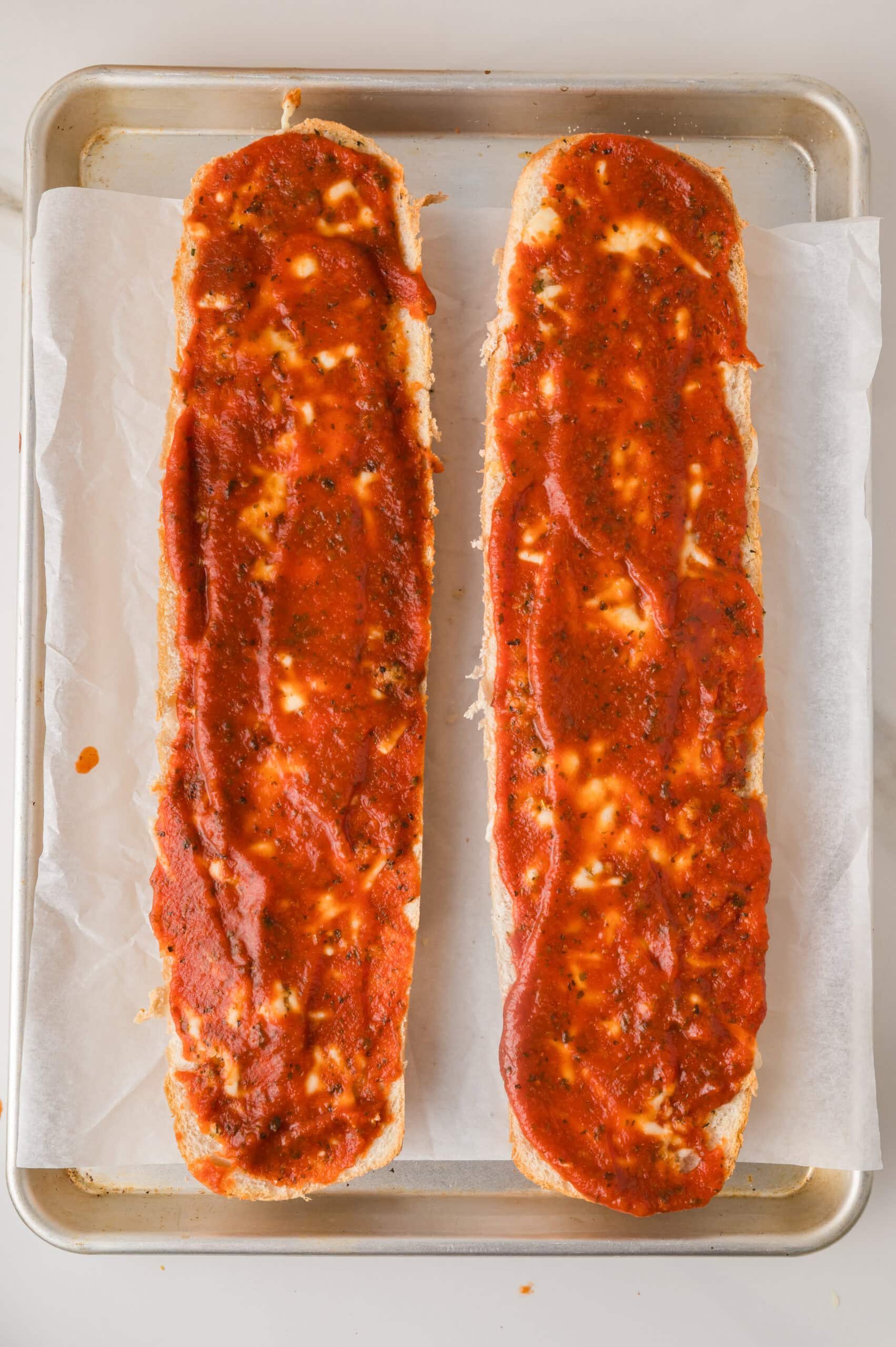 Homemade French bread pizza with marinara sauce