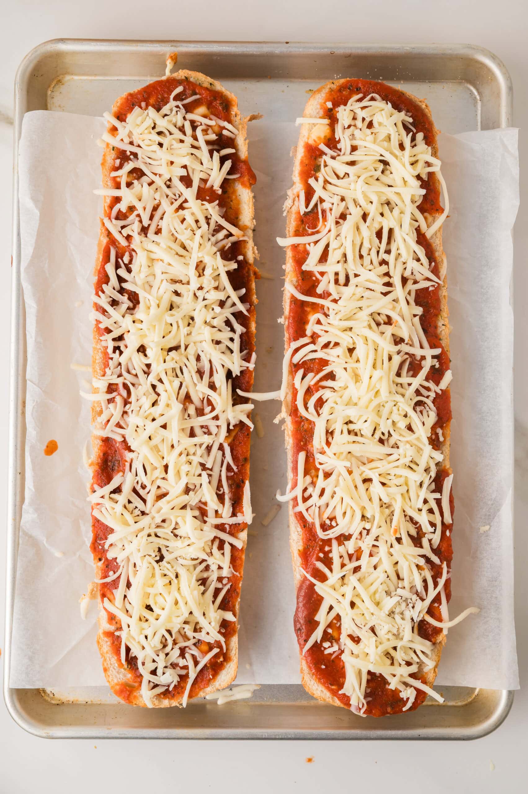 French bread pizza topped with mozzarella cheese