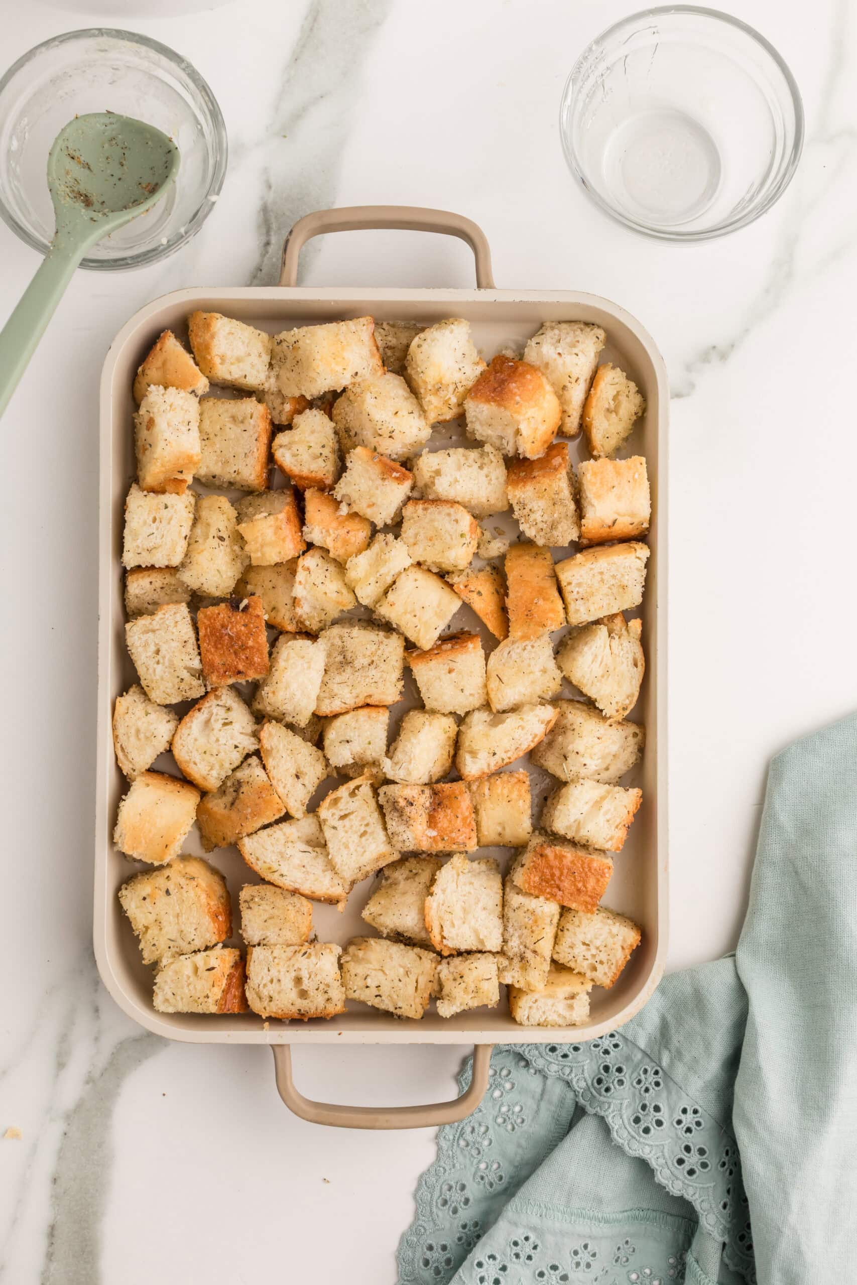 Buttered bakery bread croutons before baking