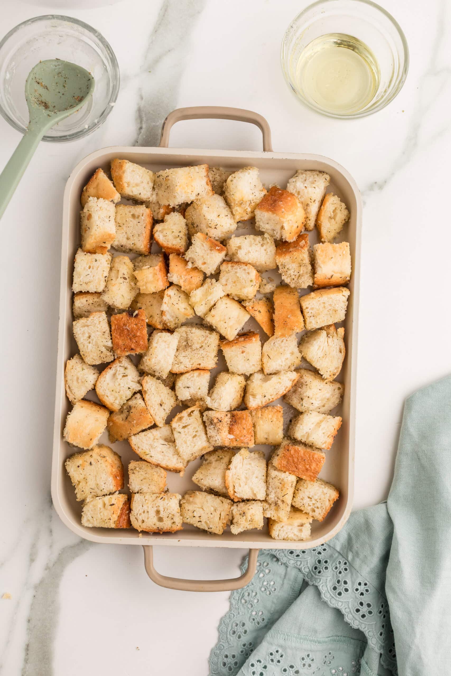 Homemade garlic croutons arranged for oven baking
