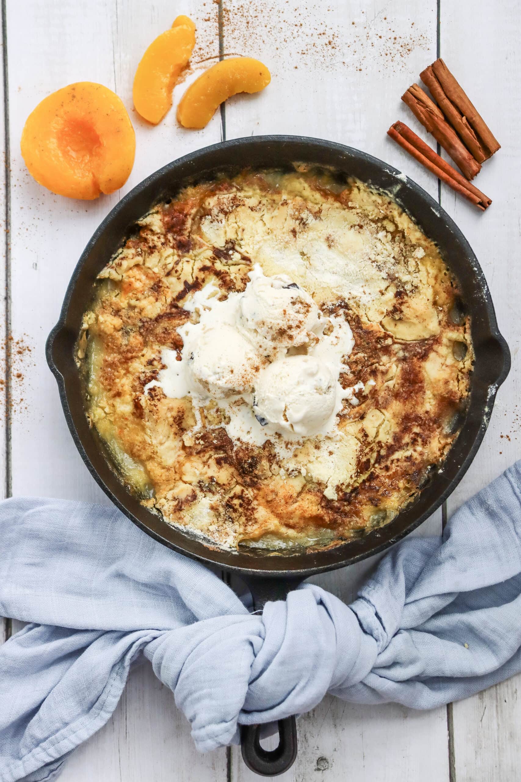 Warm skillet peach dump cake with vanilla ice cream
