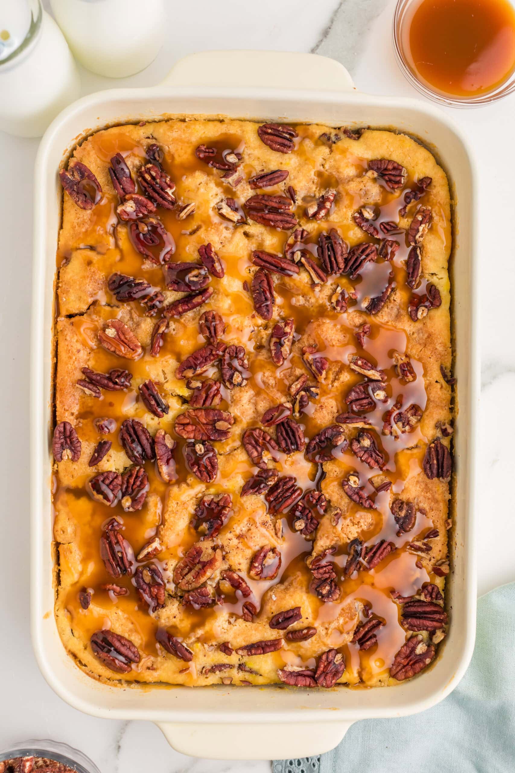 Baked pecan pie dump cake with caramel drizzle