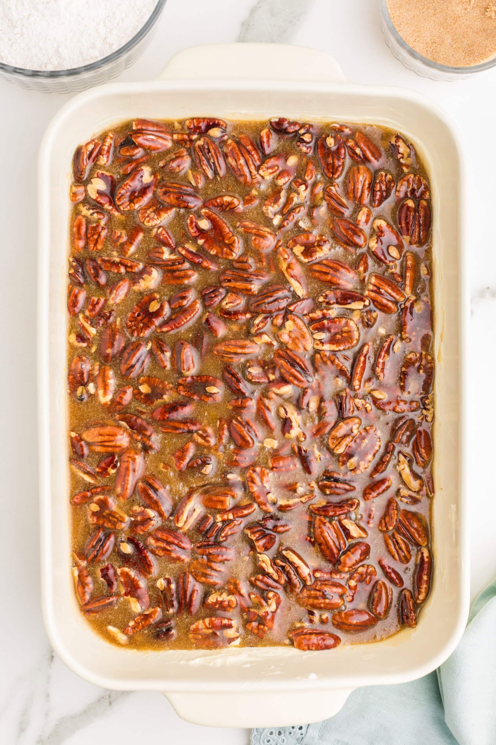 Pecan dump cake filling in baking dish