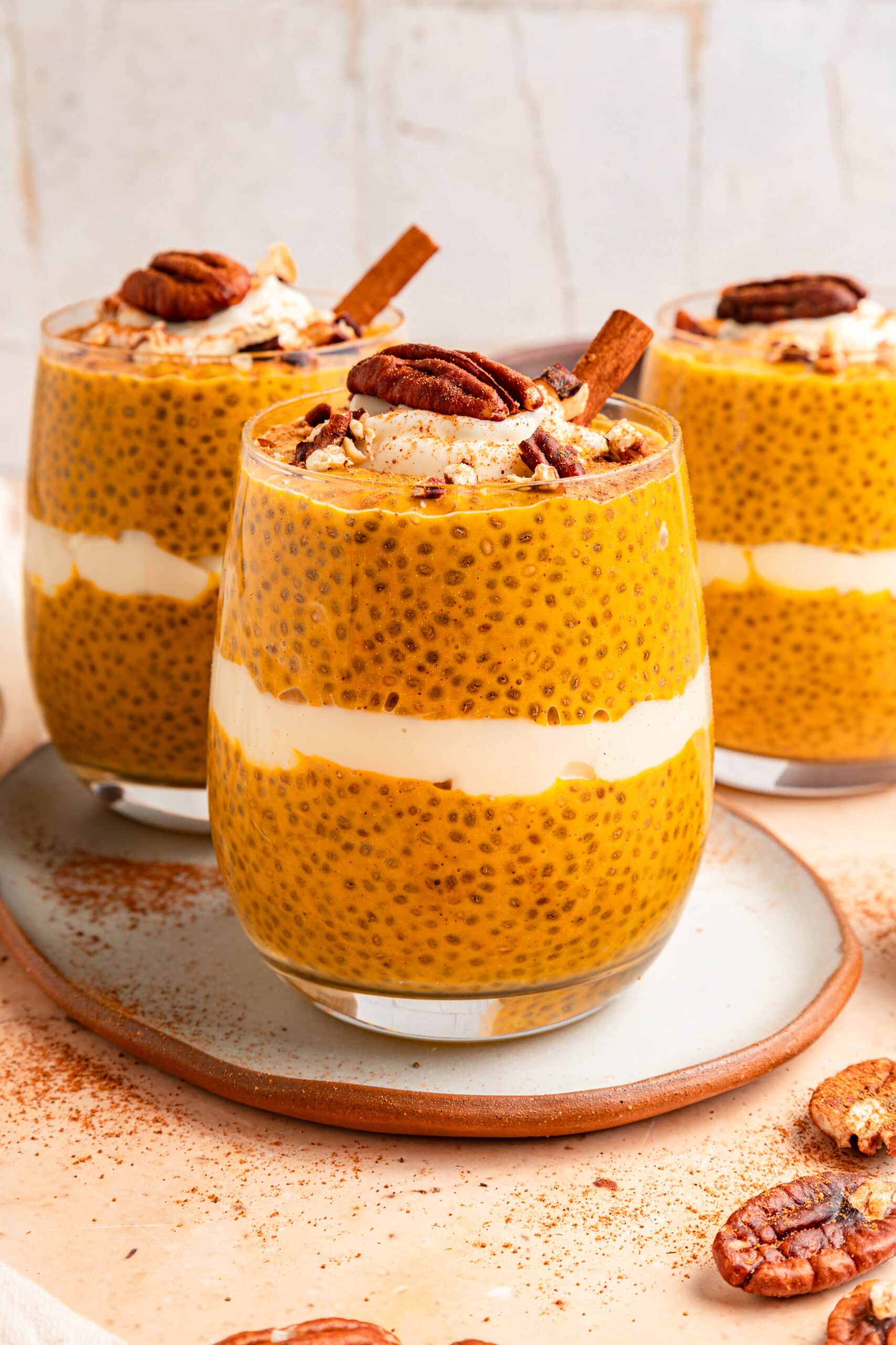 Layered pumpkin chia pudding parfaits with pecans